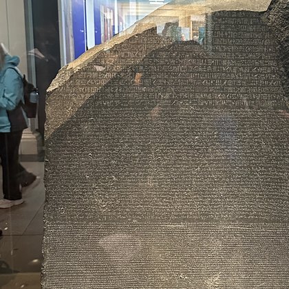 The Rosetta Stone: three scripts inscribed closely across a slab of dark granodiorite.
